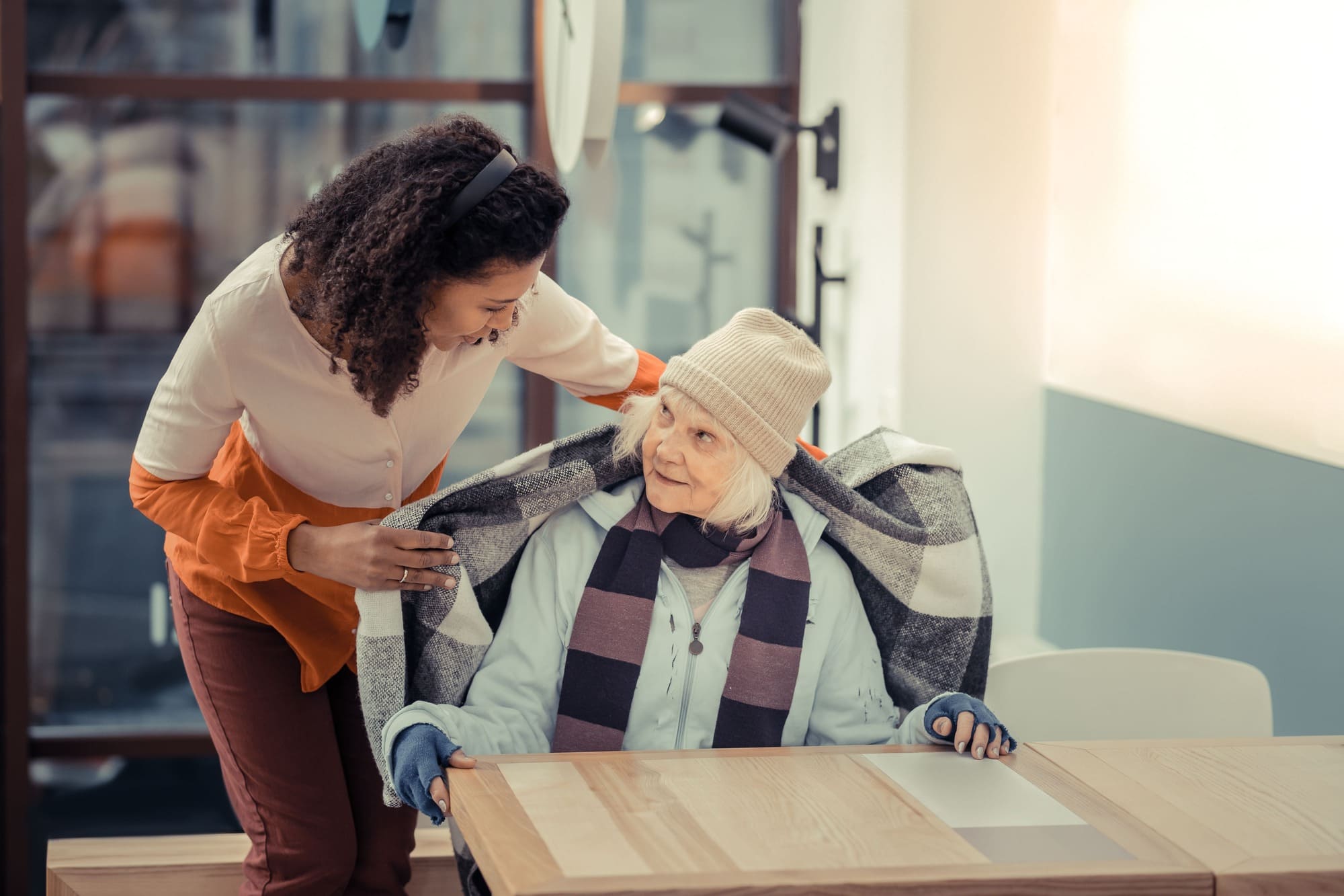 Caregiver assisting a senior resident at Wright Patt SeniorLiving